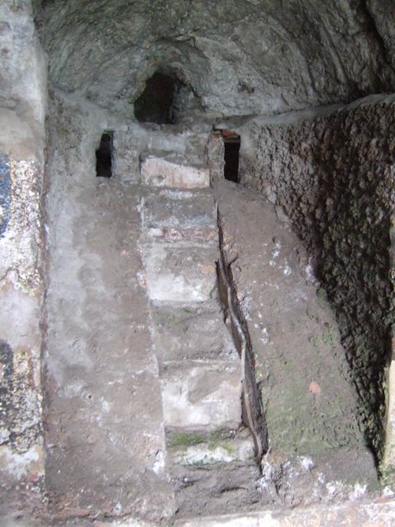 VIII.2.28 Pompeii. May 2006. Water stair of nymphaeum. On either side of the water source were small windows or recesses that may have served for special lighting effects.
See Richardson, L., 1988. Pompeii: an Architectural History. Baltimore: John Hopkins University Press. (p.231-2).
