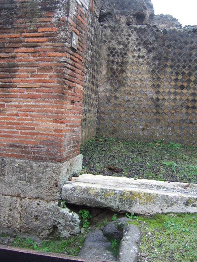 VIII.2.31 Pompeii. December 2006. East side of doorway threshold and steps outside.
 
