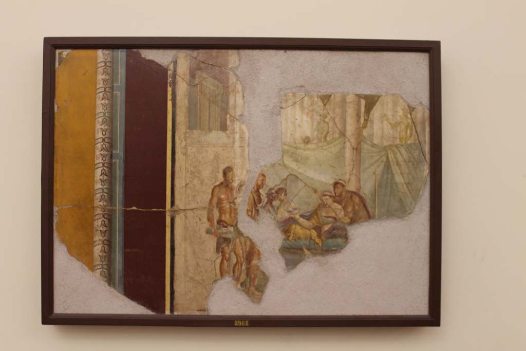 VIII.2.39 Pompeii. Pre-1843. Drawing of banqueting scene, previously identified as “Le Nozze di Sofonisba e Massinissa”. 
See Raccolta de più interessante Dipinture e di più belle Musaici rinvenuti negli Scavi di Ercolano, di Pompei, e di Stabia. 1843. Napoli.
According to Kuivalainen, in the left intercolumnium is a bearded robed male with a thyrsus in his left arm [Bacchus]. 
In the right intercolumnium there is a naked male raising his right hand with an arrow and holding a bow in his left [Apollo]. 
Both are wreathed and presented in ¾ profile. 
The statues of Bacchus and Apollo [Left and right in the background] refer to the Hellenistic multiculturalism in northern Africa, even to the honourable afterlife. 
Orphic text refer to Apollo as the resurrector of Dionysus.
See Kuivalainen, I., 2021. The Portrayal of Pompeian Bacchus. Commentationes Humanarum Litterarum 140. Helsinki: Finnish Society of Sciences and Letters, (p.87, A11, note 373).
