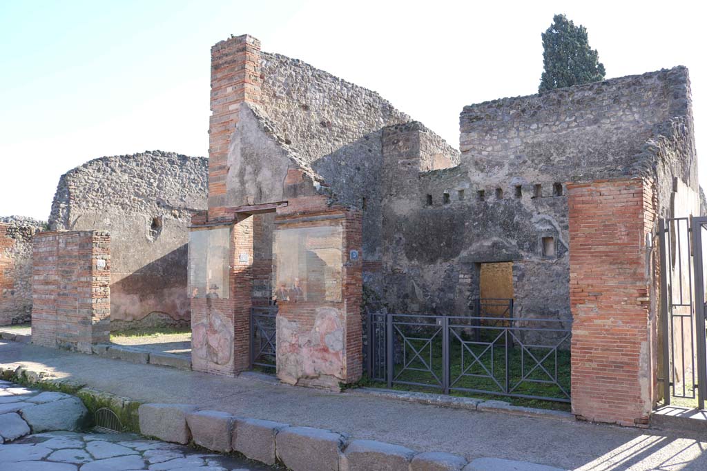 VIII.4.7, VIII.4.6, and VIII.4.5 Pompeii, right of centre. December 2018. 
Looking to entrance doorways on south side of Via dellAbbondanza. Photo courtesy of Aude Durand.

