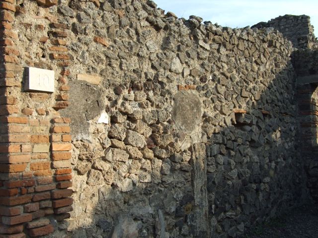 VIII.4.10 Pompeii. December 2007. West wall of shop.