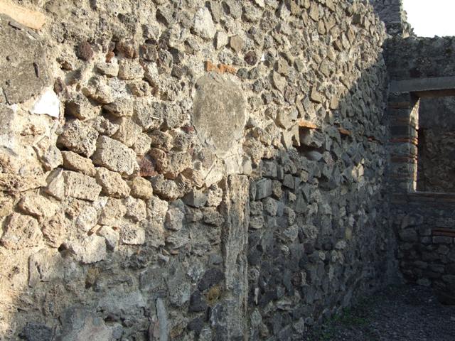 VIII.4.10 Pompeii. Shop and room. December 2007. East wall of rear room.