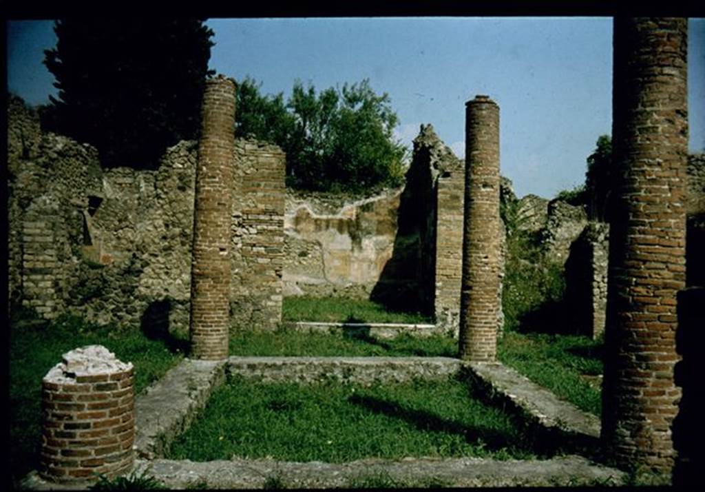VIII.4.34 Pompeii.  Impluvium with four columns.  Photographed 1970-79 by Gnther Einhorn, picture courtesy of his son Ralf Einhorn.

