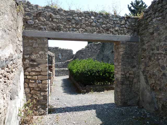 VIII.5.24 Pompeii. May 2010. Doorway to room 13, large oecus in south-west corner of west portico.