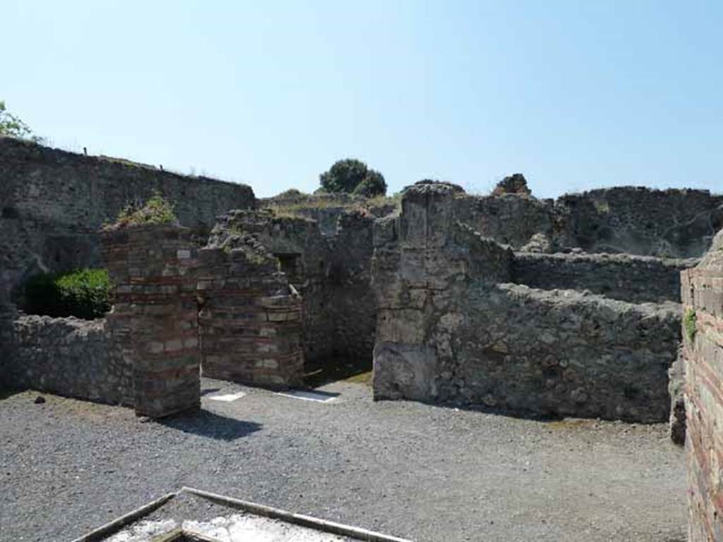 VIII.5.24 Pompeii. May 2010. Room 1, atrium. Looking south-west towards room 2, and entrance to rooms 7 and 6.