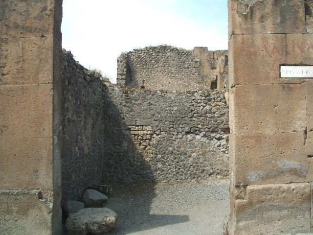 VIII.5.31 Pompeii. December 2007. Remains of graffiti painted in red on south side of entrance. According to Varone and Stefani, it was CIL IV 62.
See Varone, A. and Stefani, G., 2009. Titulorum Pictorum Pompeianorum, Rome: L’erma di Bretschneider. (p.371 & Tav. XXXI b)
According to Epigraphik-Datenbank Clauss/Slaby (See www.manfredclauss.de), it read as -

[C(aium)]  Nunidi(um)  IIv(irum)  [3]        [CIL IV 62]
