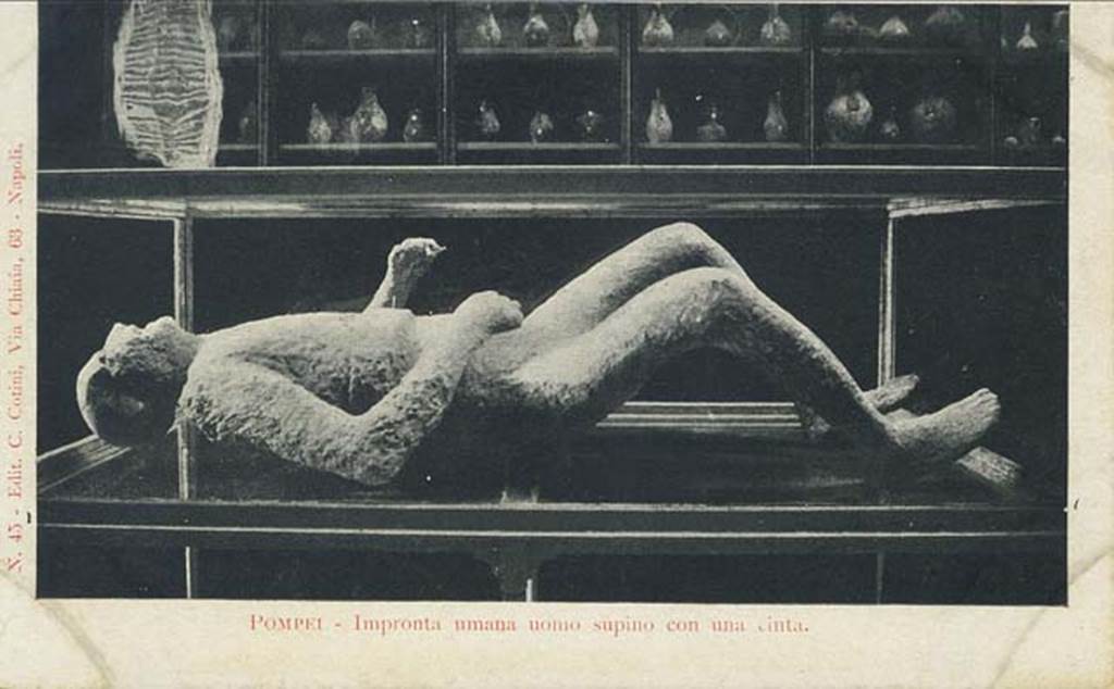VIII.6.6. Undated postcard. Plaster cast of body identified as body number 12, recovered on 28th December 1882. He was found lying on his back, wearing a large belt. This is now on display in the Macellum, see VII.9.7, see above foir a description. However in this photo he would have been on display in the Antiquarium. Photo courtesey of Rick Bauer.