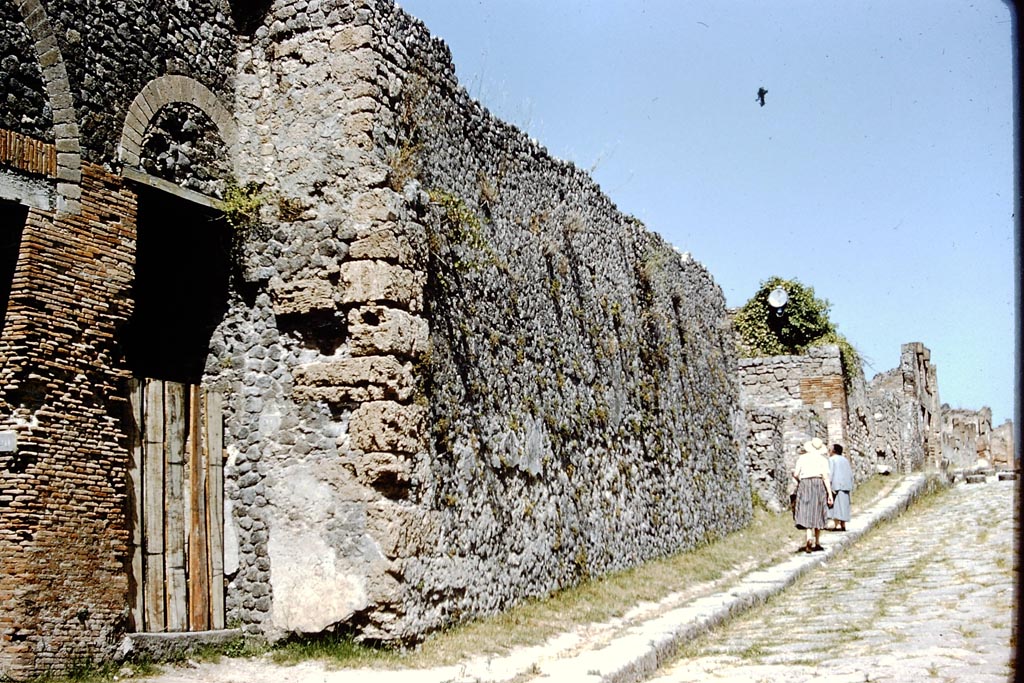 VIII.7.21 Pompeii. 1959. 
Entrance doorway on Via Stabiana with Wilhelmina Jashemski and Tatiana Warscher in a deserted roadway. Photo by Stanley A. Jashemski.
Source: The Wilhelmina and Stanley A. Jashemski archive in the University of Maryland Library, Special Collections (See collection page) and made available under the Creative Commons Attribution-Non-Commercial License v.4. See Licence and use details.
J59f0254
