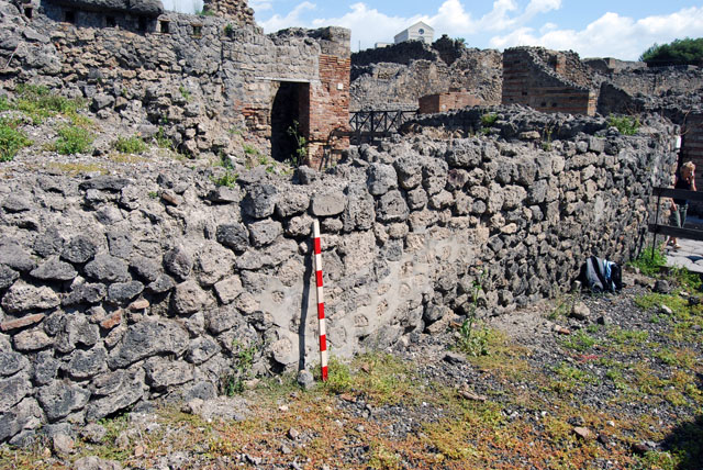 VIII.7.22 Pompeii. June 2009. Stone embedded in north wall. Photo courtesy of Sera Baker.