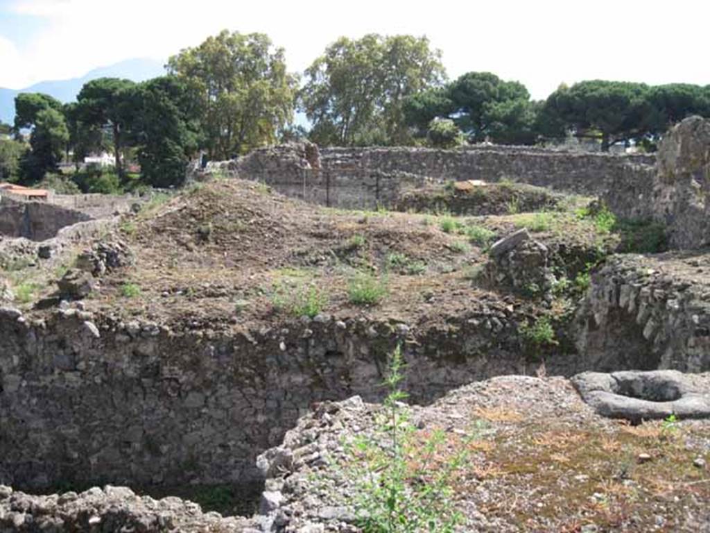 VIII.7.24 Pompeii. September 2010. Looking south from top of stairs across garden towards Odeon. Photo courtesy of Drew Baker.
