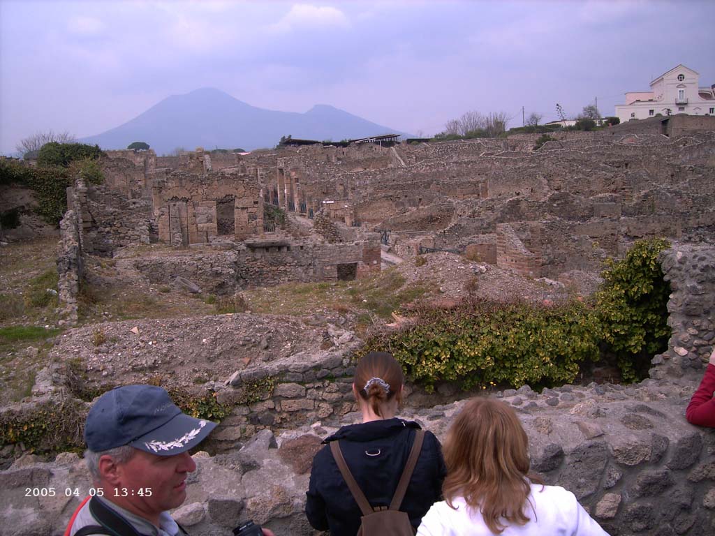 VIII.7.24 Pompeii, on left. April 2005. Looking north along Via Stabiana towards the crossroads of Holconius.
Reg. I, is on the right.  Photo courtesy of Klaus Heese.
