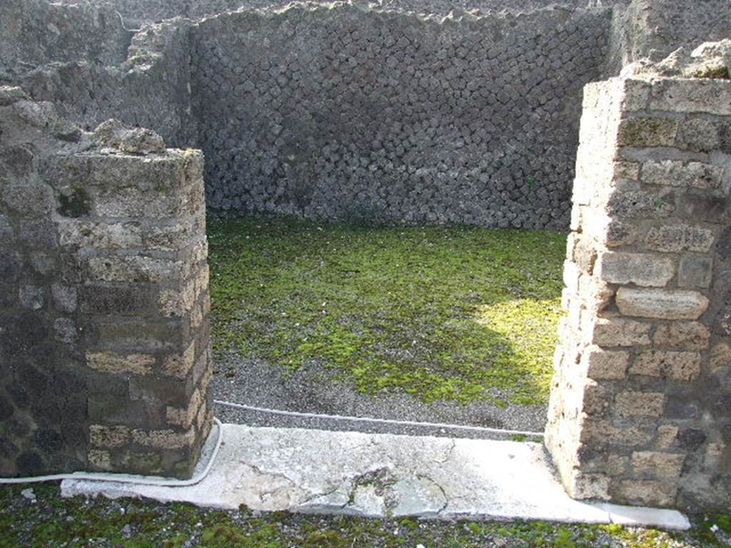 VIII.7.25 Pompeii. December 2006.   Doorway to Cella on podium.
