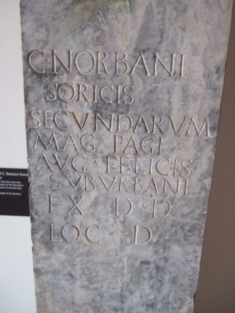 VIII.7.28 Pompeii.  Marble pillar with inscription to Gaius Norbanus Sorex: 
C(AI) NORBANI SORICIS SECVNDARVM MAG(ISTRI) PAGI AVG(VSTI)
FELICIS SVBVRBANI EX D(ECRETO) D(ECVRIONVM) LOC(O) D(ATO)
(The above bust is) of Gaius Norbanus Sorex, actor of second parts, the masters of the suburban ward of Augustus Felix (set this up) by decree of the city councillors with its location granted. See Cooley, A.E. and M.G.L., 2004, Pompeii, A Sourcebook, London. And New York, Routledge, p. 71, no. D70; CIL X 814. Now in Naples Archaeological Museum. Inventory number 4991.
