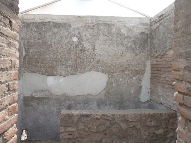 VIII.7.28 Pompeii. September 2015. Looking towards the south-west corner, and the flight of stairs leading down to the west (right) to an underground vaulted chamber, about five feet wide and six and a half feet long. According to Mau, a low base in one of the corners of the underground room, would have held a jar while it was being filled with the holy Nile water, more or less genuine, which would have been used in the sacred rites.
See Mau, A., 1907, translated by Kelsey F. W. Pompeii: Its Life and Art. New York: Macmillan. (p.179).
