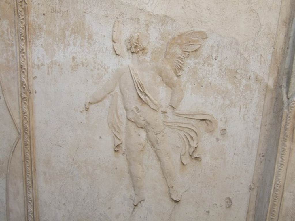 VIII.7.28 Pompeii.  December 2007. Purgatorium, east side.  Floating cupid carrying a box of incense.  See Mau, A., 1907, translated by Kelsey, F. W., Pompeii: Its Life and Art. New York: Macmillan. (p. 180).

