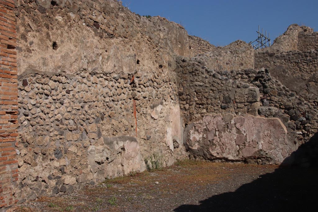 IX.1.1 Pompeii. May 2010. South wall of shop, looking east to rear room. 
