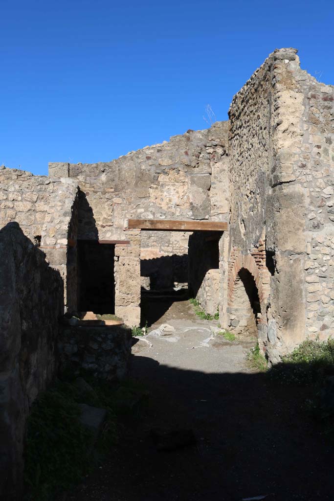 IX.1.3/33 Pompeii. December 2018. 
Looking north along rear of bakery. Photo courtesy of Aude Durand.

