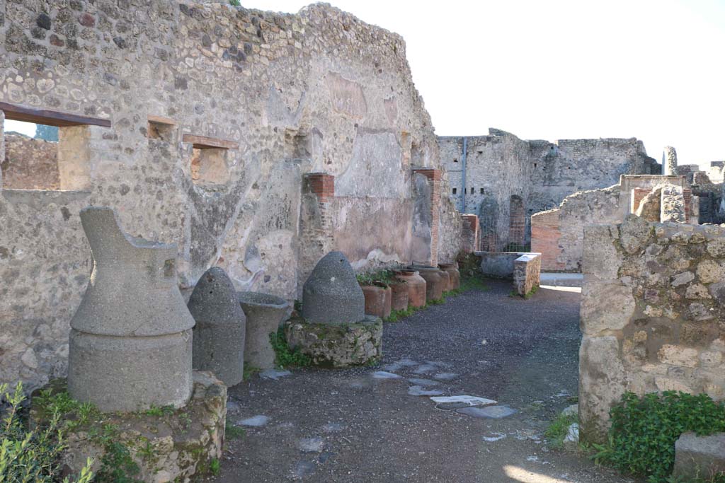IX.1.3 Pompeii. May 2017. Looking towards lower stone step of stairs to upper floor, on east side of doorway to cubiculum, on left. Photo courtesy of Buzz Ferebee.
