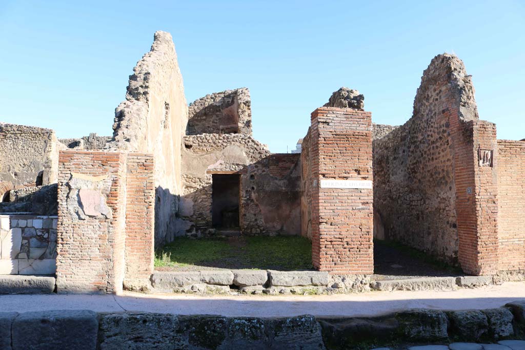 IX.1.4 Pompeii, in centre, IX.1.5, on right. December 2018. Looking east to entrances. Photo courtesy of Aude Durand.
