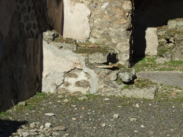 IX.1.4 Pompeii. May 2010. Remains of hearth in south-east corner of rear room.