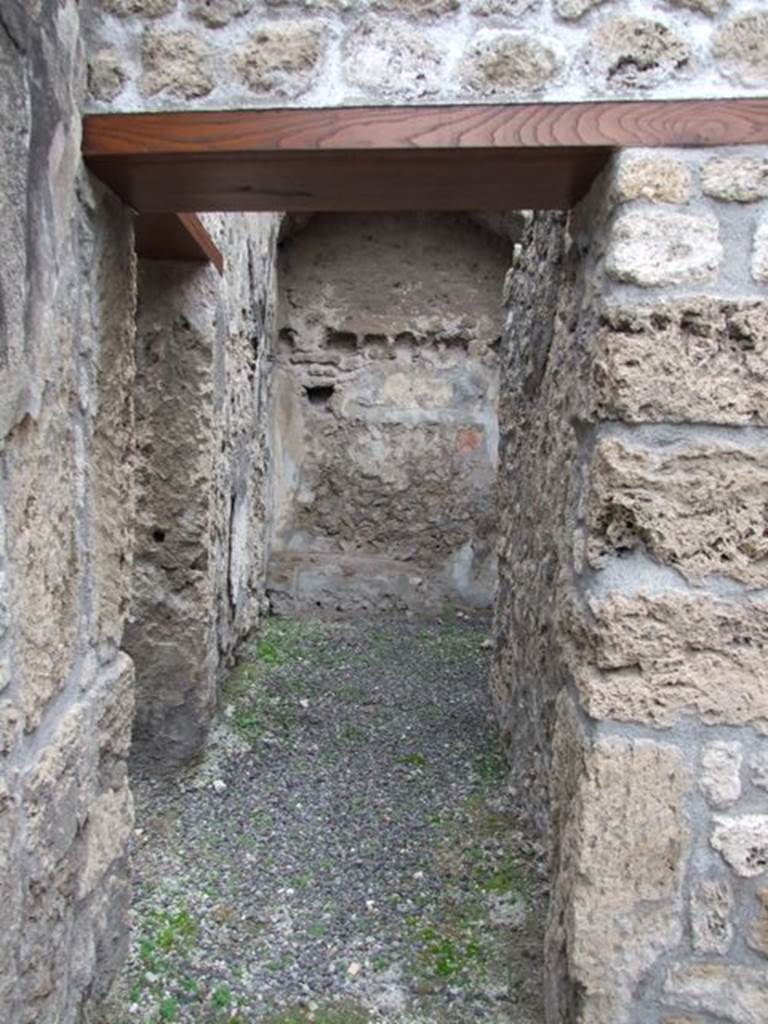 IX.1.12  Pompeii. December 2007.  Corridor on north-west side of peristyle next to stone steps.
