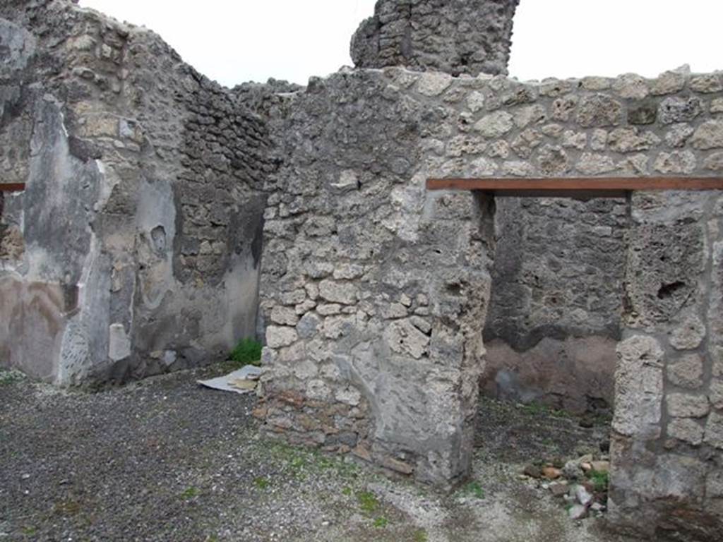 IX.1.12 Pompeii. December 2007. South side of atrium with doorway to cubiculum and small room or cupboard.