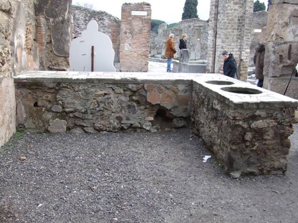 IX.1.16 Pompeii. December 2007. Looking south from rear of counter.