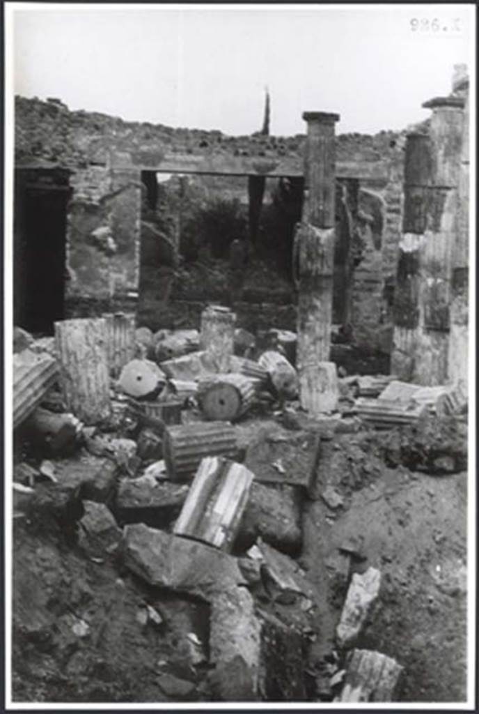 IX.1.20 Pompeii. c.1943-6. Room 2, atrium. Bomb damage.
According to Garcia y Garcia, this house was one of the most savagely damaged during one of the allied air raids in September 1943.
The great Corinthian atrium, hit in its centre in the middle of the impluvium, was completely annihilated, with the destruction of the impluvium and the cutting down of the sixteen tufa Doric columns.
The bombing also caused the demolition of the façade wall towards the Via dell’Abbondanza, including the fauces and the neighbouring rooms.
With the immediate restoration and by saving every little snippet, the columns were reconstructed, but it was only possible to restore a fraction of the facade.
See Garcia y Garcia, L., 2006. Danni di guerra a Pompei. Rome: L’Erma di Bretschneider. (p.149-50)
Photo courtesy of British School at Rome Digital Collections.
See Photo details at BSR
