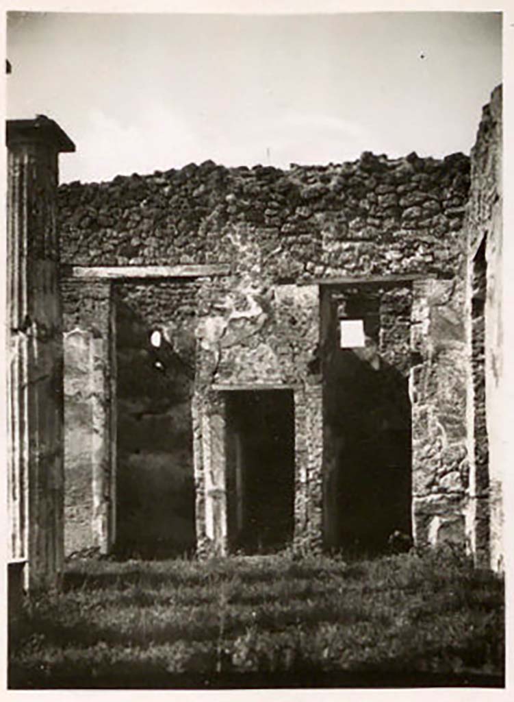 IX.1.20 Pompeii. Pre-1943. Looking towards doorways on west wall in north-west corner of atrium. 
The window in the room on the right, overlooks IX.1.12. Photo by Tatiana Warscher.
See Warscher, T. Codex Topographicus Pompeianus, IX.1. (1943), Swedish Institute, Rome. (no.104), p. 181.
