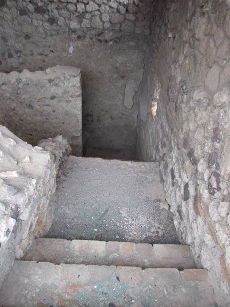 IX.1.20 Pompeii.  December 2007.  Looking down staircase at the rear of Room 15.

