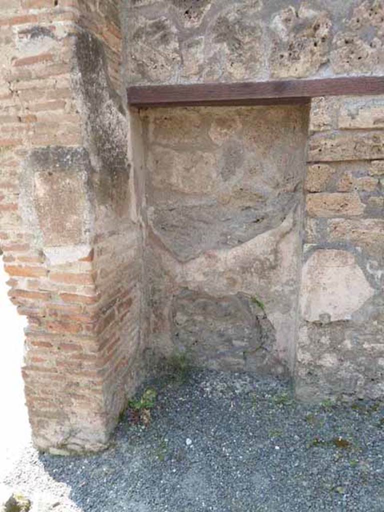 IX.1.24 Pompeii. May 2010. Blocked doorway or niche in south-west corner of shop.