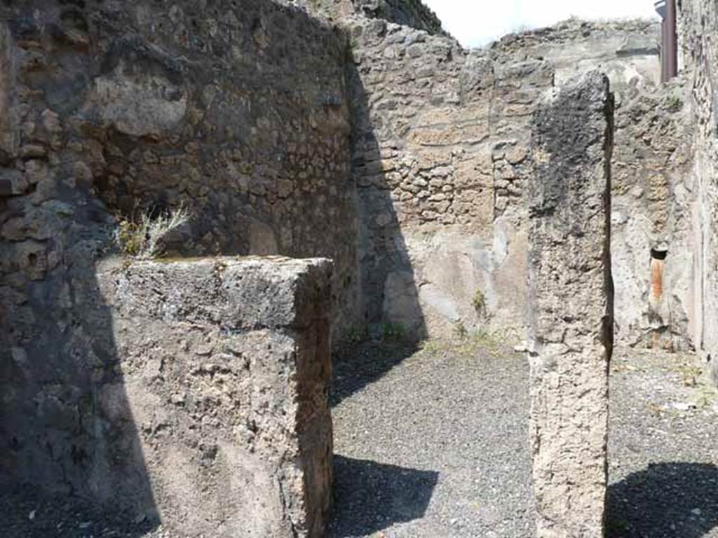 IX.1.24 Pompeii. May 2010. Doorway to rear room, on left, and steps to area above, on right.