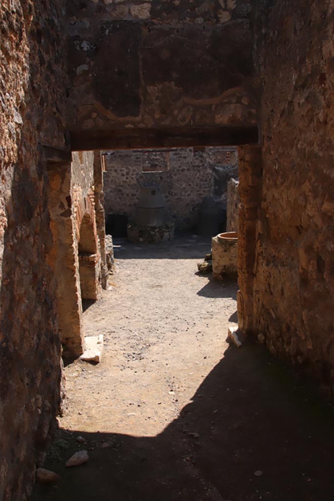 IX.1.33 Pompeii. October 2022. 
Looking south into bakery, from rear side entrance. Photo courtesy of Klaus Heese
