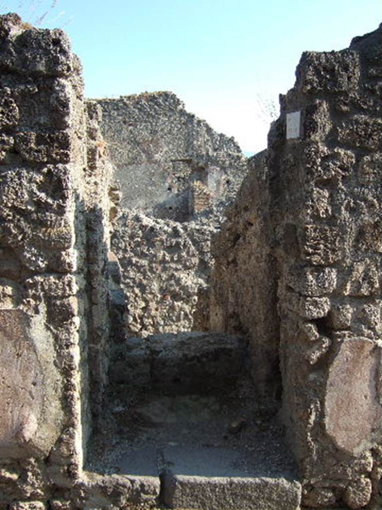 IX.1.34 Pompeii. Stairs to upper floor with latrine of IX.1.1 behind.