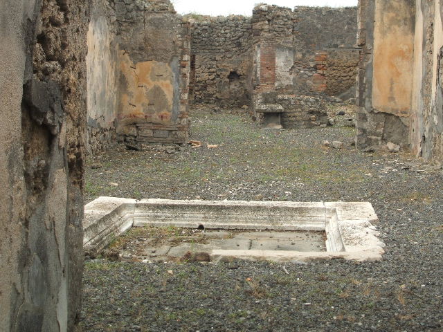 IX.2.18 Pompeii. March 2009.  Room 1. Impluvium in Atrium. Looking south west.