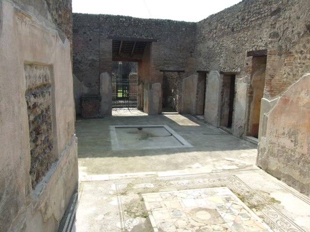 IX.3.5 Pompeii. March 2009. Room 30. Atrium. East wall. Masonry supports for cupboards.