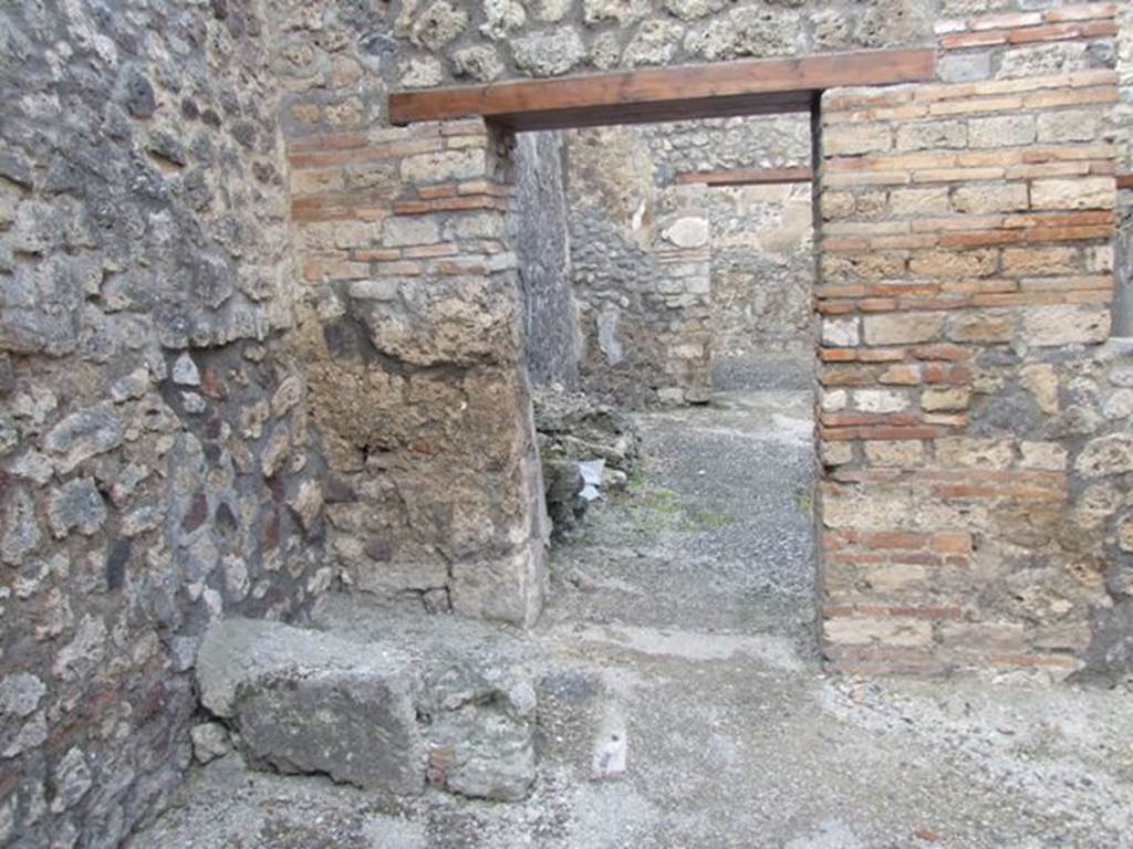 IX.3.13 Pompeii. March 2009.   North wall of caupona, with remains of stairs in north-west corner, and doorway to dwelling. On the west wall, on the left, under the stairs would have been a lararium painting, now disappeared.  Luckily both Fiorelli and Sogliano wrote a good description. 
Fiorelli told us that there was a Genius flanked by Lares, the caricature of a male head, and two gladiators in combat.  Sogliano reported that the painting was done in red monochrome on white plaster, and showed a Genius with patera and corncupocia, sacrificing at the altar in the middle of two Lares with rhyton and situla. 
See Pappalardo, U., 2001. La Descrizione di Pompei per Giuseppe Fiorelli (1875). Napoli: Massa Editore. (p. 146)
See Sogliano, A., 1879. Le pitture murali campane scoverte negli anni 1867-79. Napoli: (p.11)
See Boyce G. K., 1937. Corpus of the Lararia of Pompeii. Rome: MAAR 14. (p.83-4) 
See Jacobelli, L., 2003. Gladiators at Pompeii. Rome: LErma di Bretschneider. (p. 82)
