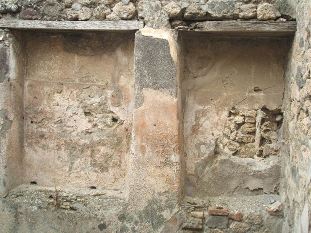 IX.3.14 Pompeii. May 2005. Two recesses in room in north-east corner of shop-room.  