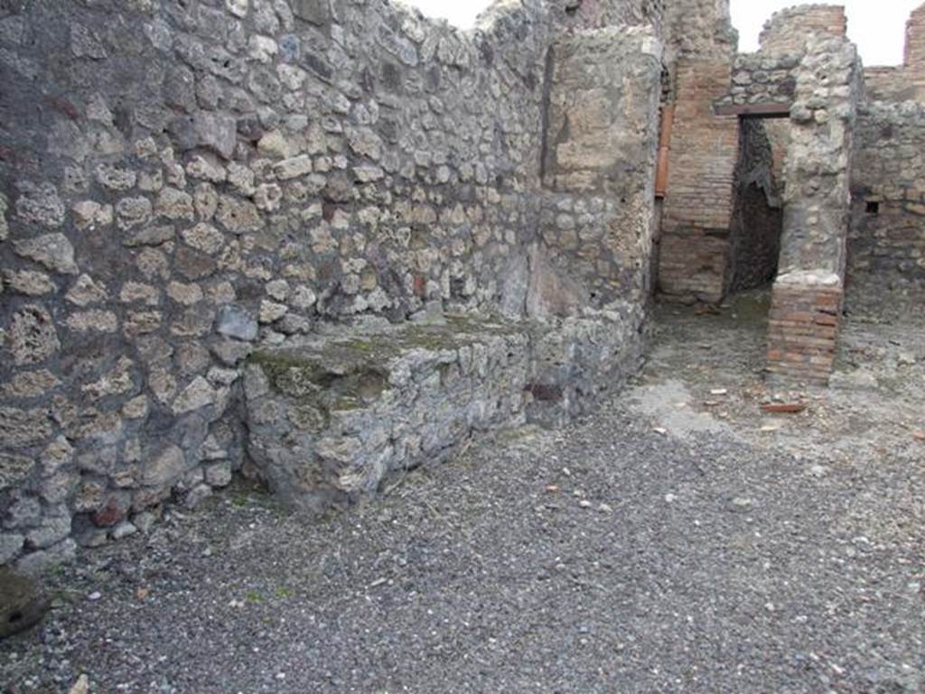 IX.3.17  Pompeii.  March 2009.  West side of workshop.  Remains of bench with water basin.