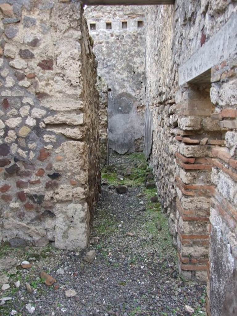 IX.5.2 Pompeii. December 2007. 
Corridor on south-east corner of peristyle p. leading to rooms x and y, on left and ahead.
On the right is the small doorway into room v.

