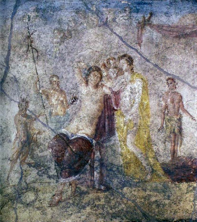 IX.5.14 Pompeii. Room f, centre of east wall of triclinium. Painting of Dionysus and Ariadne.
Now in Naples Archaeological Museum. Inventory number 111481. 
Kuivalainen comments: This composition may be an alternative artistic interpretation of Bacchus and Ariadne after having reached an understanding. The cupid is indeed sometimes depicted with Ariadne, not only with Venus. Ariadnes yellow robe can refer to her bridal status.
See Kuivalainen, I., 2021. The Portrayal of Pompeian Bacchus. Commentationes Humanarum Litterarum 140. Helsinki: Finnish Society of Sciences and Letters, (p.132, D12).
