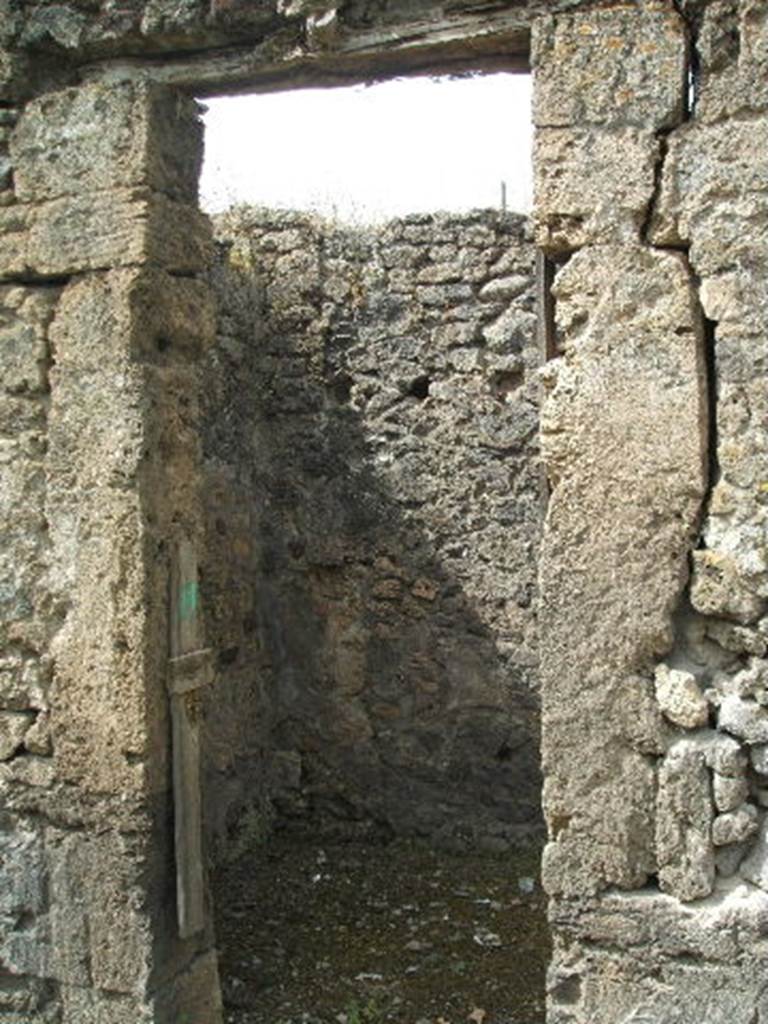 IX.6.g Pompeii. Niche set into west wall of room in north-west corner of peristyle.
According to Boyce, in a small room in the north-west corner of the peristyle, in the middle of the west wall was an arched niche.
Its size – h.0.32, w.0.31, d.0.15, height above floor 1.42.
This was adorned with an aedicula façade of half-columns on each side supporting a cornice.
The cornice ran around the curve of the arch instead of a pediment.
The lower half of each column was red, the upper half white
This inside walls of the niche were decorated with many small irregular blotches of red on a white background.
See Bullettino dell’Instituto di Corrispondenza Archeologica (DAIR), 1881, p. 23.
See Boyce G. K., 1937. Corpus of the Lararia of Pompeii. Rome: MAAR 14. (p. 87, no.435 and Pl.3, 6).

