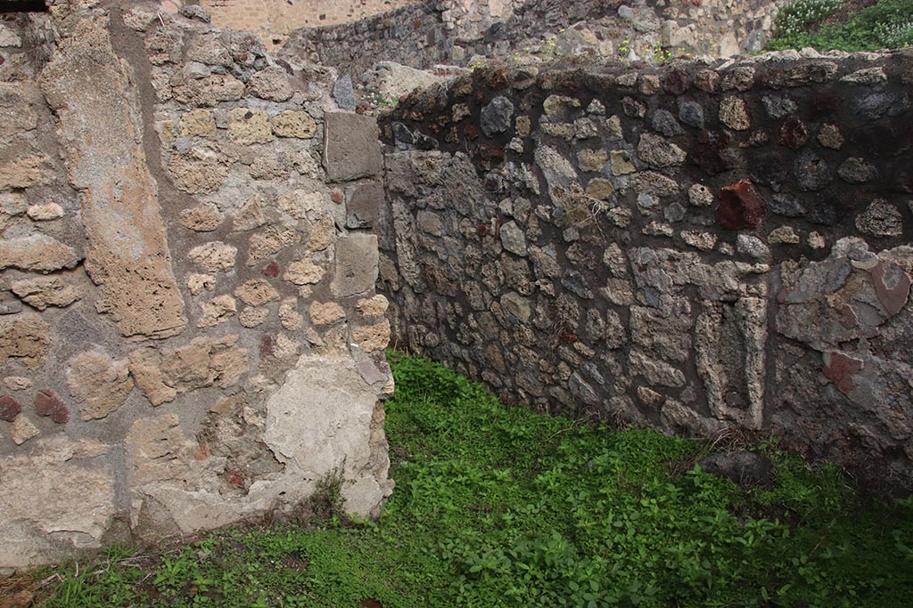 IX.7.19 Pompeii. October 2024. Room k, looking towards north wall at east end, with doorway to corridor f. Photo courtesy of Klaus Heese.