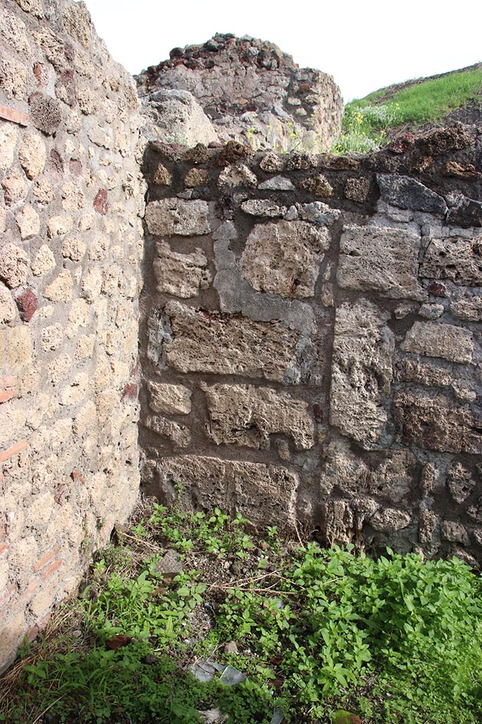 IX.7.19 Pompeii. October 2024. 
Corridor f, blocked doorway at north end of east wall. Photo courtesy of Klaus Heese.
