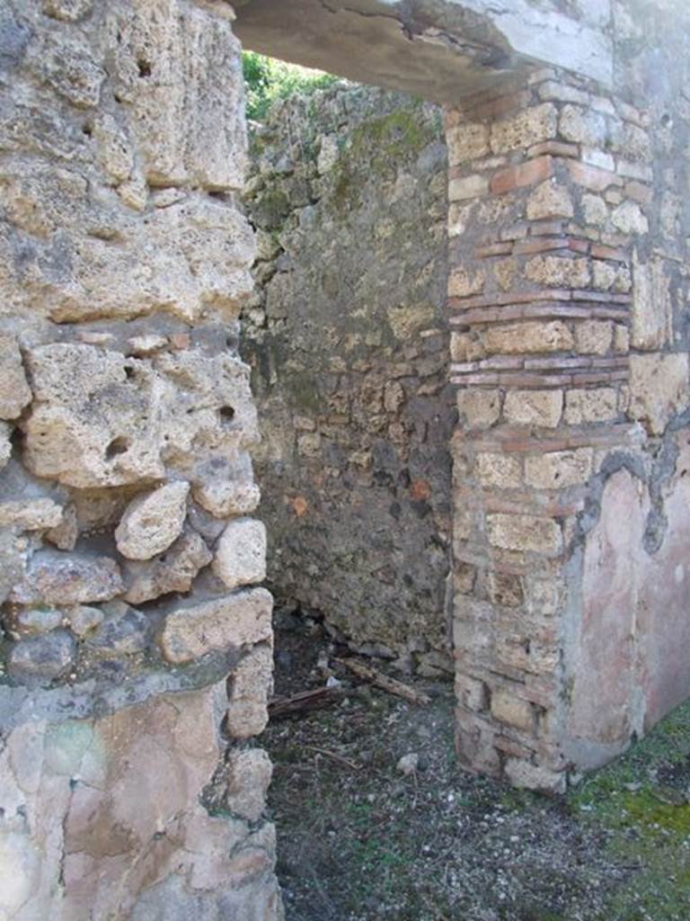 IX.9.13 Pompeii.  March 2009.  Doorway to Room 5, Cubiculum. Looking south from south passageway of garden.