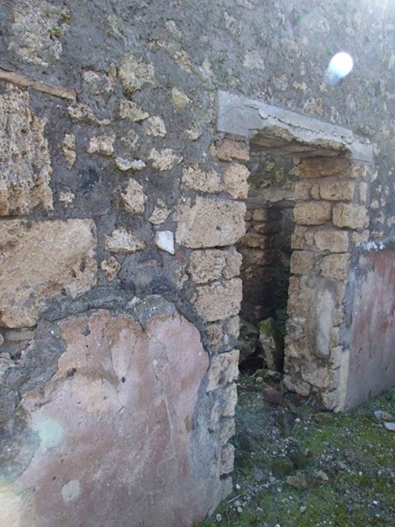 IX.9.13 Pompeii.  March 2009.  Doorway to Room 7.  Small room or cupboard.