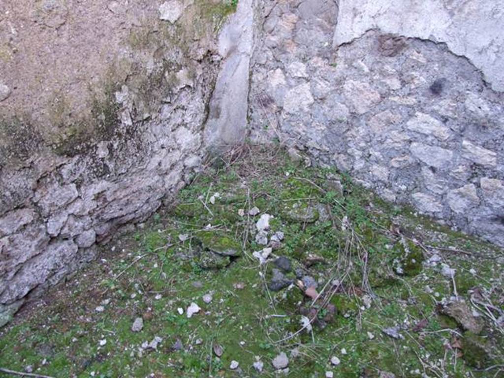 IX.9.13 Pompeii. March 2009. Room 9, remains of hearth or bench in north-west corner of kitchen.