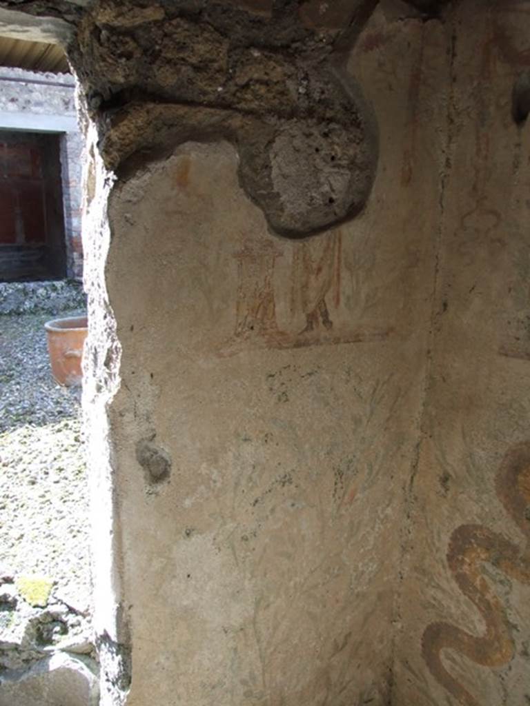 IX.9.c Pompeii. March 2009. North-west corner of kitchen, with painted lararium. 