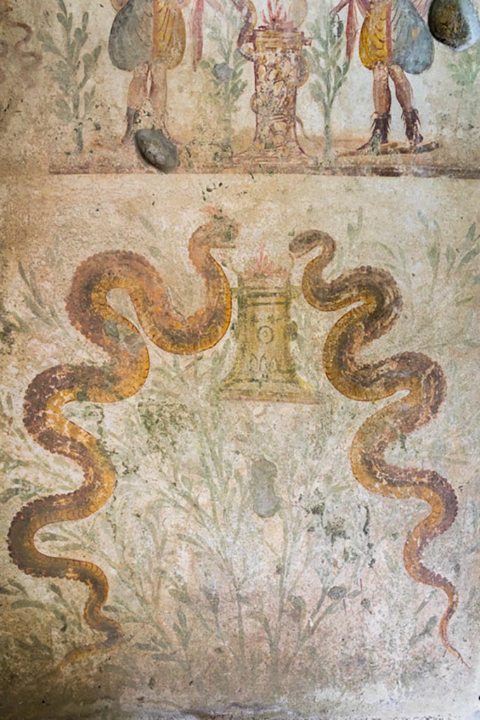 IX.9.c Pompeii. March 2023. 
Two serpents painted on north wall of kitchen area. Photo courtesy of Johannes Eber.
