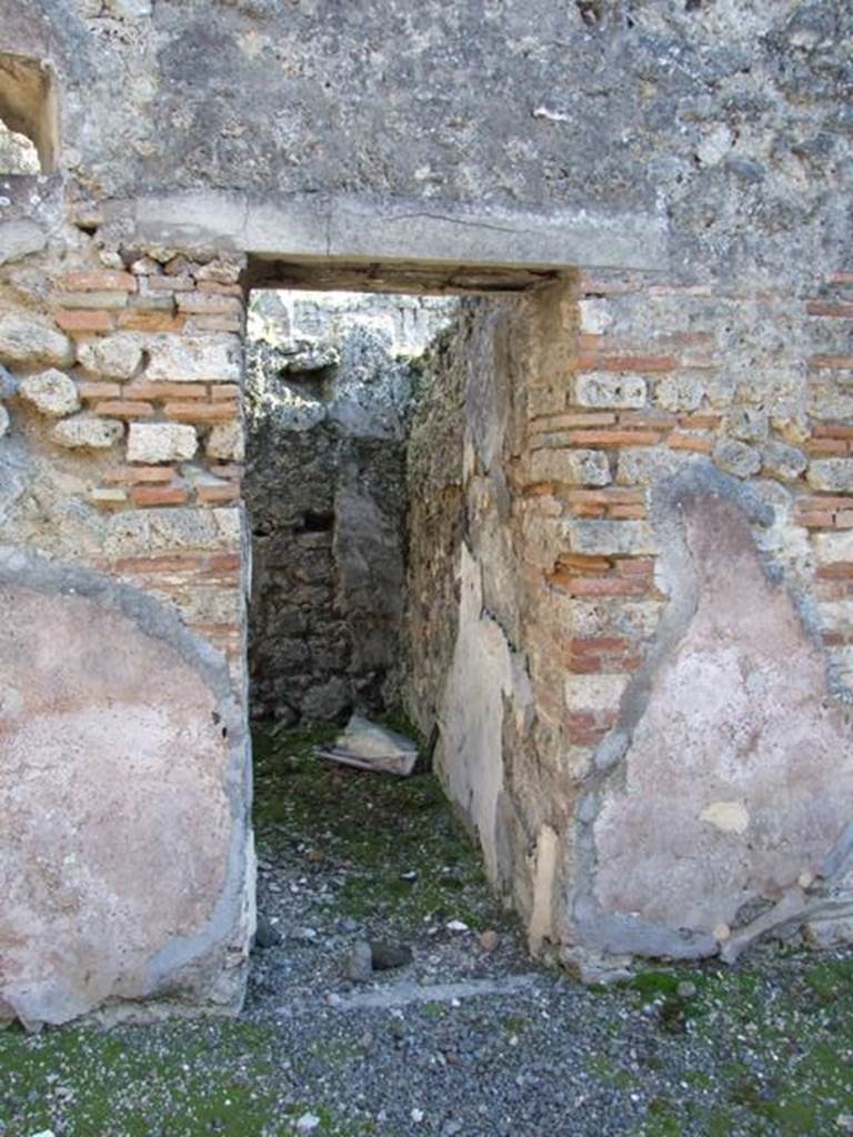 IX.9.d Pompeii. March 2009. Doorway to room m, cubiculum. According to NdS, this cubiculum would have had Opus signinum flooring and walls with white background.

